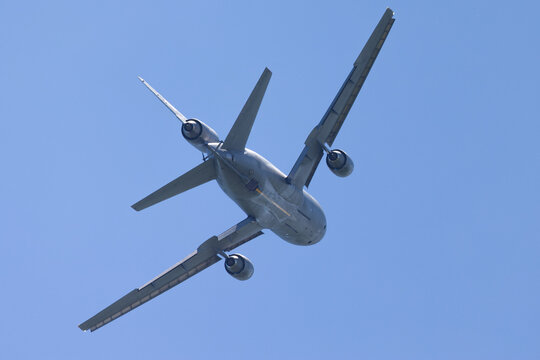 Tail view of a KC-10 extender tanker aircraft with boom extended