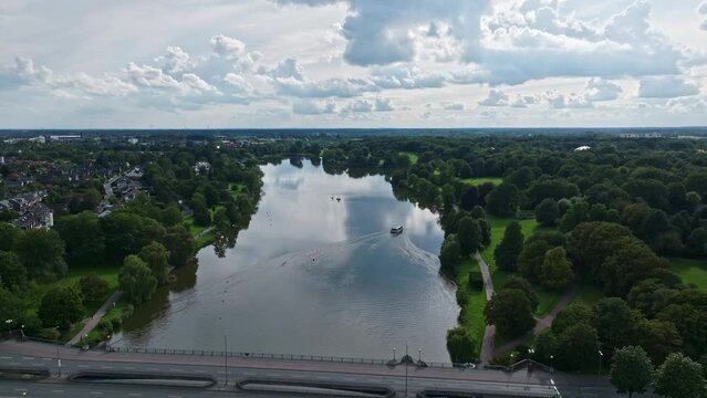 An aerial drone view of Aasee Lake in M&uuml;nster . Lake Aasee is an artificial lake located in M&uuml;nster , Germany .