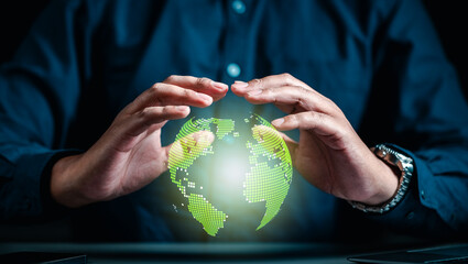 continent, sustainable, global, nature, globe, help, networking, climate, planet, responsibility. A man is holding a green globe in his hands. Concept of protection and care for the planet.