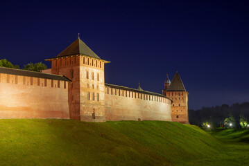 At the wall of the ancient Novgorod Detinets (Kremlin) on a July night. Veliky Novgorod, Russia