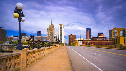St. Paul City in Minnesota, skyline, skyscrapers, and St. Paul City Hall over the Robert Street Bridge and Mississippi River in the Upper Midwestern United States