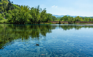 Idyllic view at Posta Fibreno Lake Natural Reserve. In the province of Frosinone, Lazio, Italy.