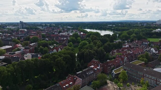 An aerial drone view of Aasee Lake in M&uuml;nster . Lake Aasee is an artificial lake located in M&uuml;nster , Germany .