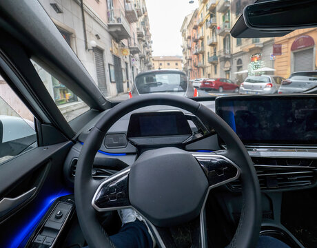 Empty cockpit electric vehicle, Head Up Display and digital speedometer. Steering wheel of electric vehicle, interior, cockpit, electric buttons. Autonomous car. Driverless car. Self-driving vehicle.