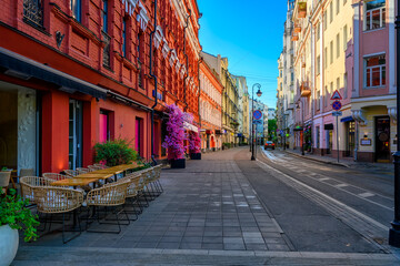 Street with tables of cafe in center of Moscow in Russia. Cozy cityscape in Moscow. Architecture and landmarks of Moscow. - 790254313