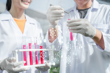 examination, chemistry, biochemistry, chemical, lab, research, scientific, science, tube, specialist. Two scientists are holding test tubes. and working on a project that involves chemistry.