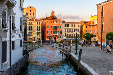 Narrow canal with bridge and Grand Canal in Venice, Italy. Architecture and landmark of Venice....