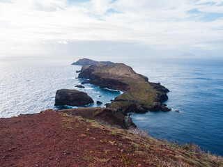 Island Ilheu da Cevada and Ilheu do Farol, seen from Ponta de Sao Lourenco, Canical, East coast of Madeira Island, Portugal. Scenic volcanic landscape of Atlantic Ocean, rocks and cllifs and sky - 790257996
