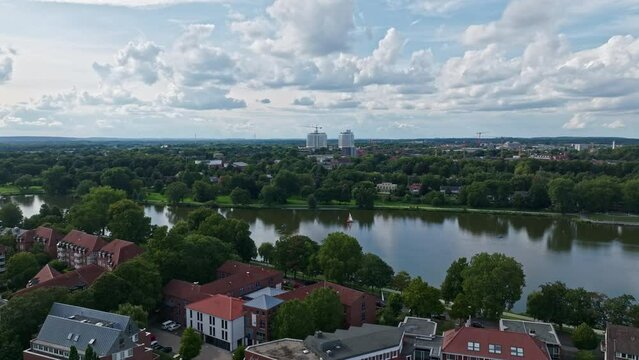 An aerial drone view of Aasee Lake in M&uuml;nster . Lake Aasee is an artificial lake located in M&uuml;nster , Germany .