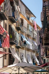 Fotobehang Old blind covered balconies in the heart of Palermo's back streets © Chantal Reed