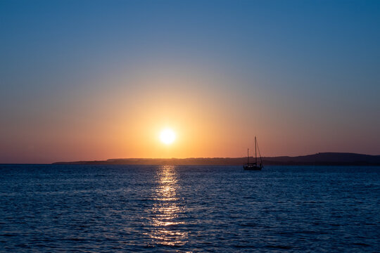 Yacht at anchor  at Calaforte, Sant Antioco, Sardinia, at sunset