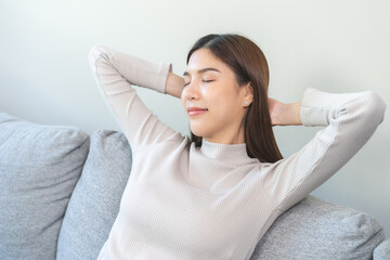 Relaxed serene, happy calm attractive asian young woman peace of mind, relaxing on comfortable...