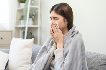 Sick, coronavirus or covid, tired asian young woman have a fever, flu and hand in use tissues paper...