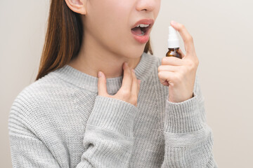 Health care treatment sore throat concept, sick pain asian young woman have cough symptom holding...