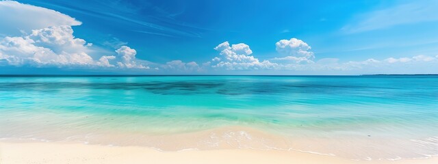 A breathtaking photograph of secluded white sand beach, with vibrant turquoise waters and clear blue skies, offering ample space for text placement