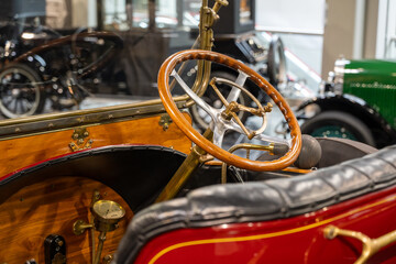 Vintage car wood and leather interior from the early 20th century.
