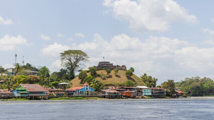 Scenic view of colorful church and fortress of El Castillo village along the San Juan river in Nicaragua