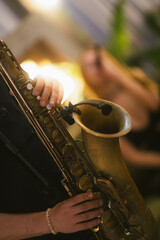 Captured in the midst of a concert, the essence of a saxophone's allure is framed in close-up