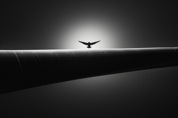 A close-up of a wind turbine blade, emphasizing the sleek design and massive scale, with a bird soar - obrazy, fototapety, plakaty