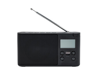 Detail of a small black battery-powered portable radio on a white background. It is a radio with...