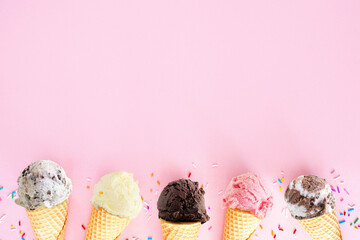 Ice cream cone bottom border over a pink background. Chocolate, strawberry and vanilla flavors....