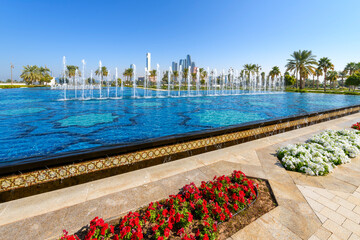 View of the modern Abu Dhabi skyline from one of the four large water features at the Qasr Al Watan...