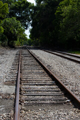Railroad tracks fading into the distance, vanishing point.