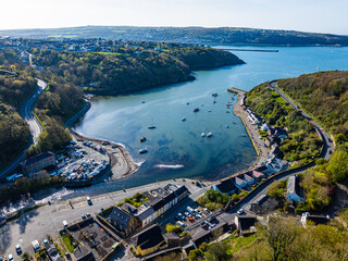 Aerial shot of small fishing village harbour with boats at Fishguard, Pembrokeshire, Wales. - obrazy, fototapety, plakaty