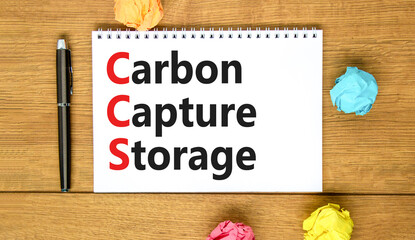 CCS Carbon capture storage symbol. Concept words CCS Carbon capture storage on beautiful white note. Beautiful wooden table background. Business ecological Carbon capture storage concept. Copy space.