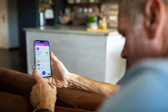 Man checking bank account on smartphone app