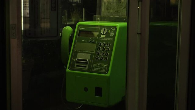JAPAN - MARCH 2024 : View of PUBLIC PHONE BOX (Pay phone) at the street.