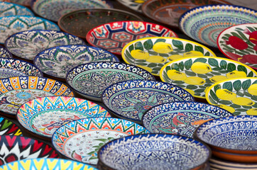 Plates and pots on a street market in the city of Bukhara, Uzbekistan.Traditional souvenir.