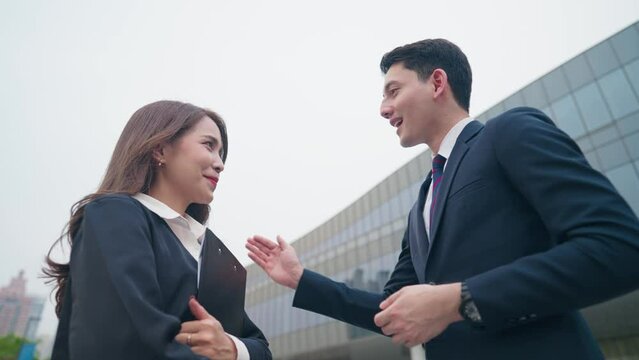 Happy white male company boss giving positive compliments to his secretary, satisfied boss at work, supervisor pleased that his employee finish the job on time, empathy boss with useful feedbacks
