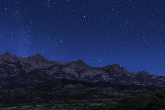 The photo captures the night sky over a majestic mountain range, showcasing the stars in the clear, dark sky, Contours of a mountain range under a star-lit night sky, AI Generated
