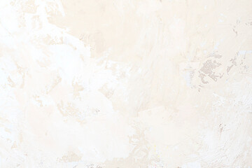 The texture of the plaster on the wall, rough strokes made with a palette knife, paint on the surface, abstract background for design.