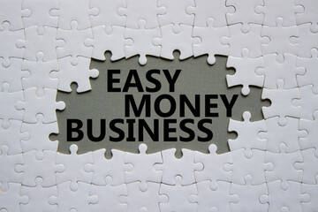 Easy Money Business symbol. Concept words Easy Money Business on white puzzle. Beautiful grey...