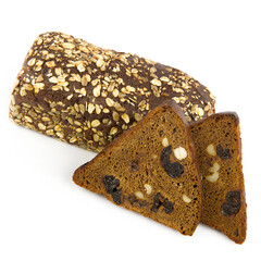 Homemade bread with dried fruits, raisins, prunes, hazelnuts and walnuts isolated on a white background.