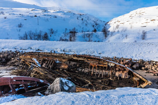The cemetery of ships in Teriberka — The rotting remains of abandoned fishing vessels more than half a century ago resemble images of sea monsters on the shores of the Barents Sea, Murmansk, Russia