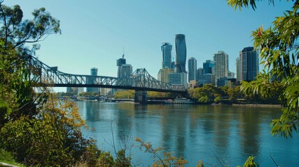 Fototapeta premium Cityscape with bridge: A modern city skyline is framed by a majestic bridge stretching across the tranquil river below.