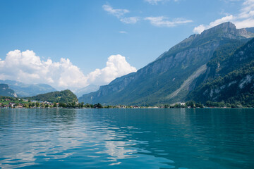 view over lake Brienzersee to lake shore and mountains, Bernese Oberland