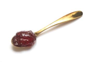 jam speard on spoon isolate white background