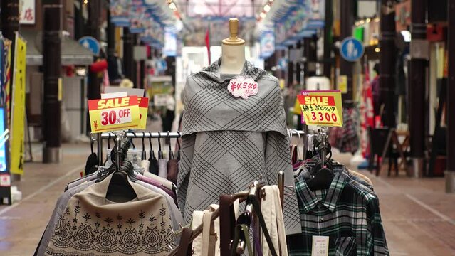 JAPAN - MAR 2024 : View of clothing store at shopping arcade. Japanese fashion industry concept video.