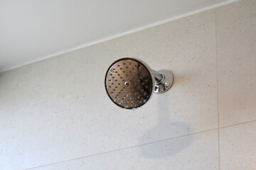 Wall with metal shower installed