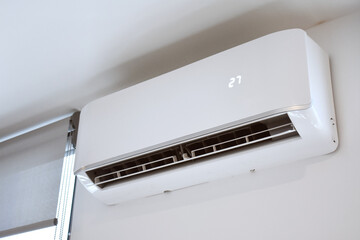 Air conditioning unit on bedroom wall