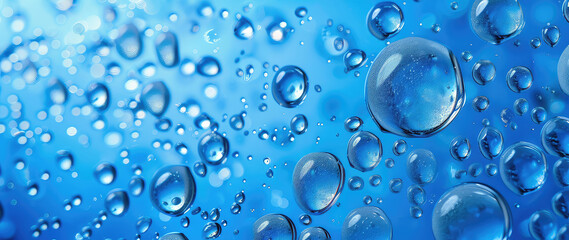Macro shot of water droplets on a blue surface