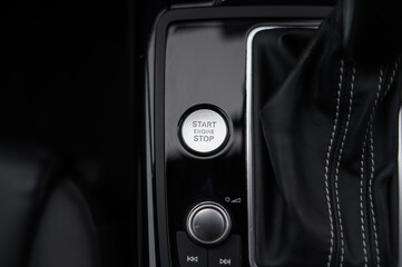 Obraz premium Modern Push Start/Stop Button in Luxury Car