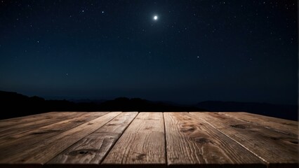 Wooden platform against a star lit night sky with moonlight