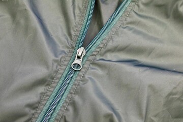 Zipper on a green windbreaker  © Douglas