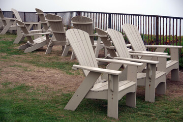 Adirondack chairs on a foggy day at the California coast