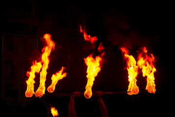 Fire Ball Dancers perform along a street of Kandy in Sri Lanka during the Esala Perahera (great procession). - Powered by Adobe